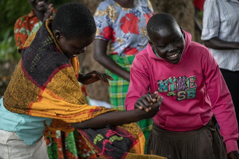 Two women greeting one another with joy