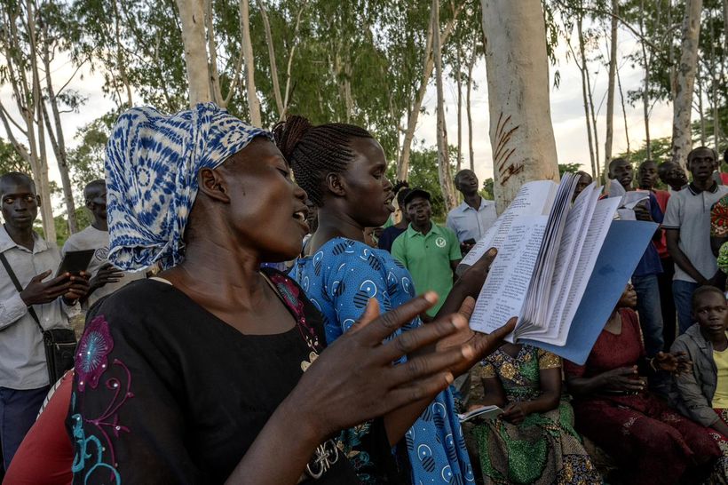 Women singing and reading Scripture together