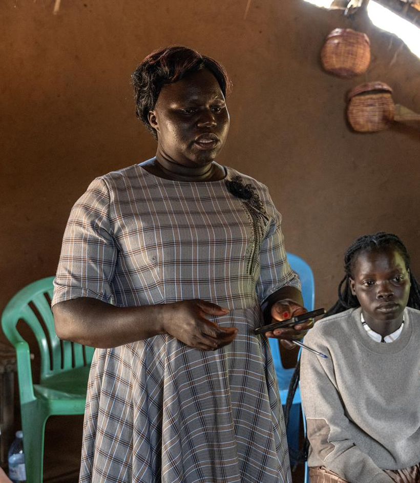 A woman teaching in a home gathering