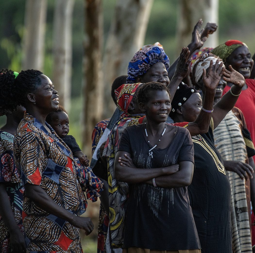 Women gathered and singing together with their Bibles